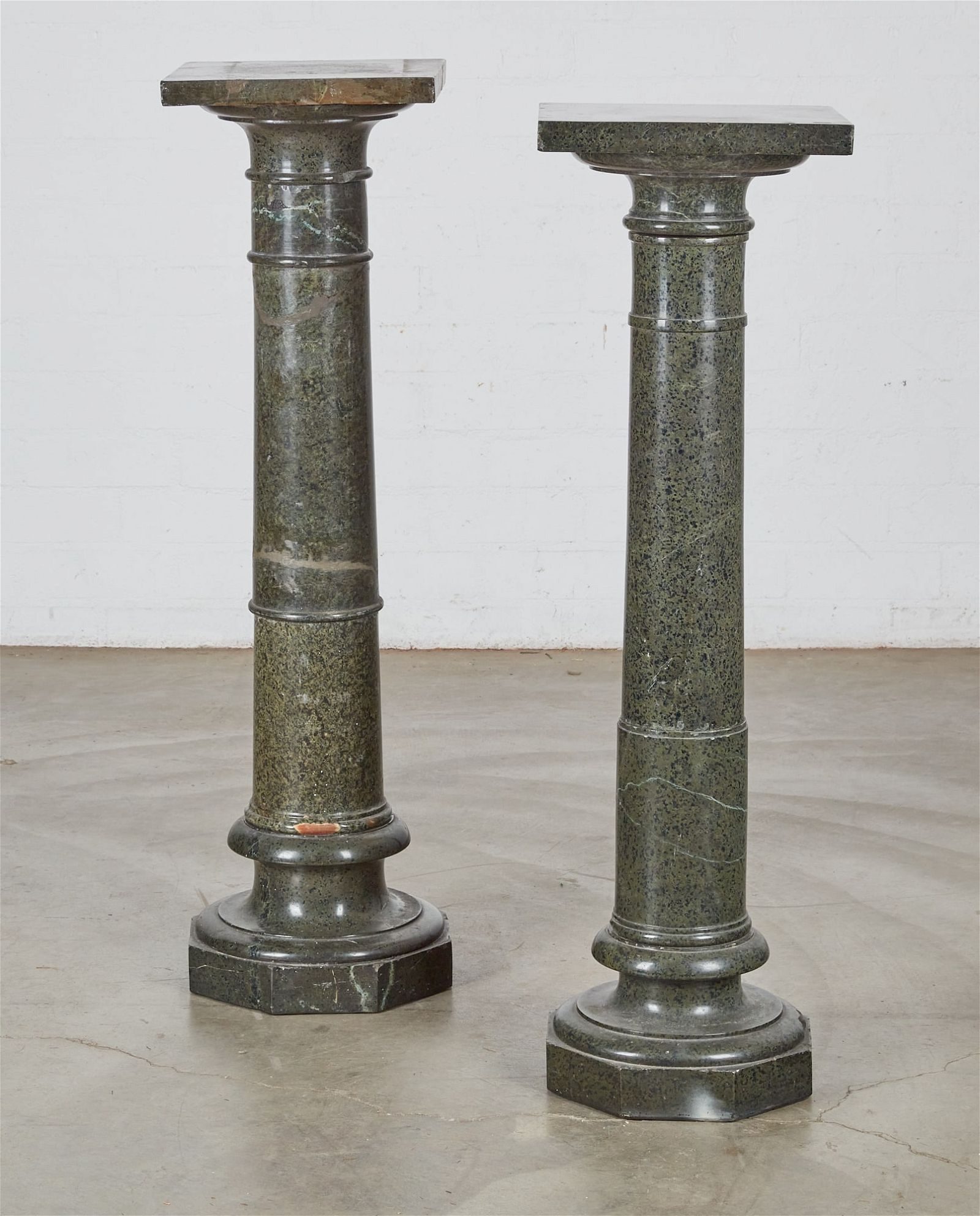 TWO SERPENTINE PEDESTALS WITH