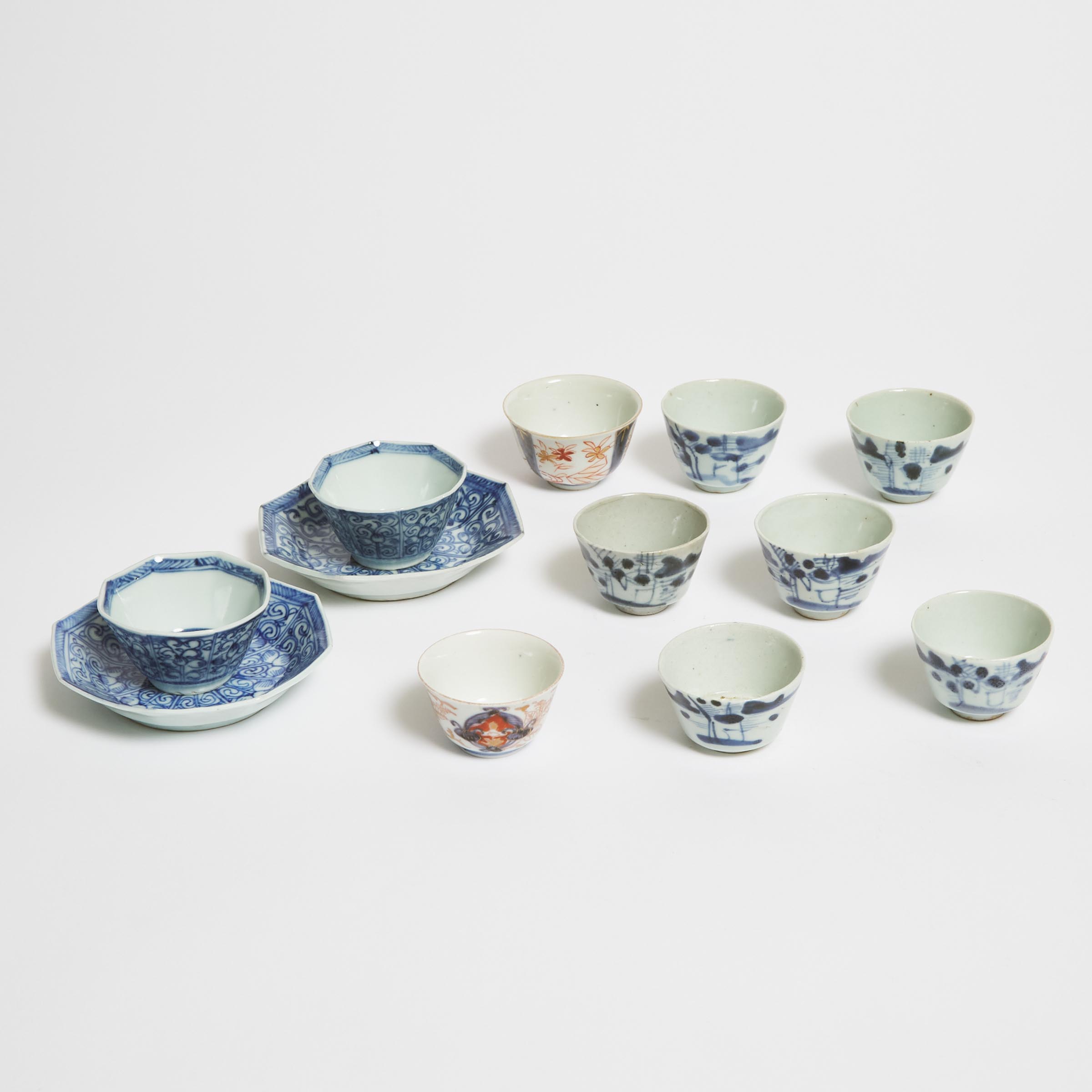 Two Sets of Blue and White Cups and