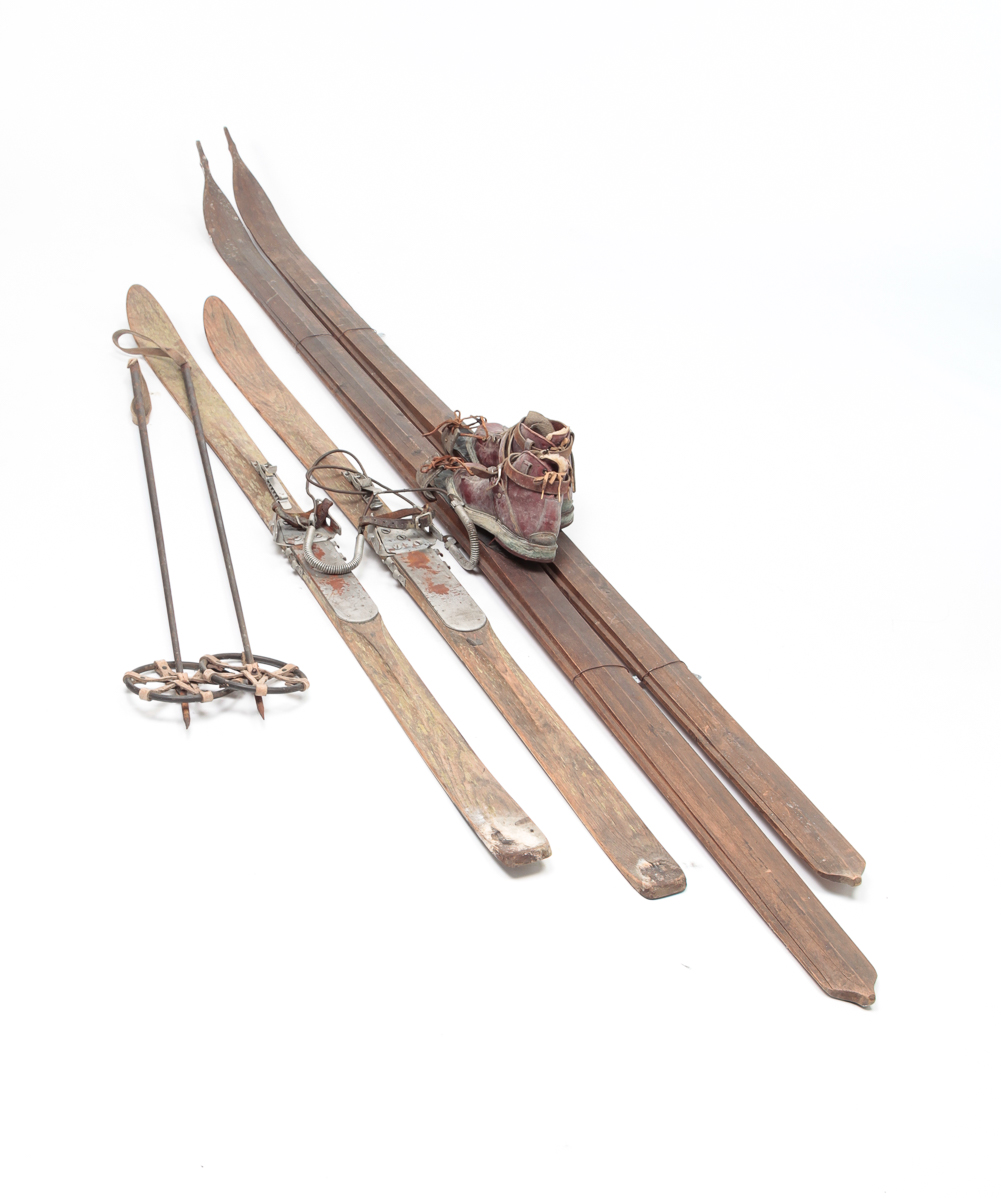 TWO SETS OF WOODEN SKIS. First half