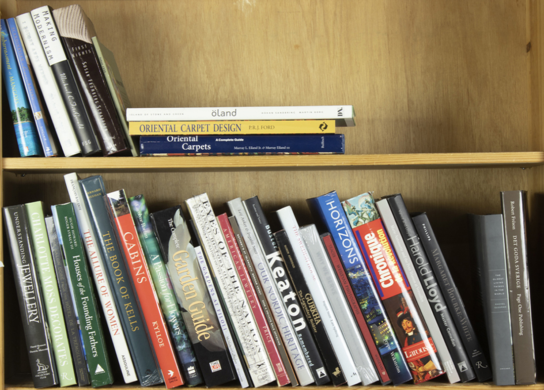 TWO SHELVES OF ART AND REFERENCE