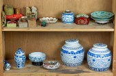 TWO SHELVES OF ASIAN DECORATIO