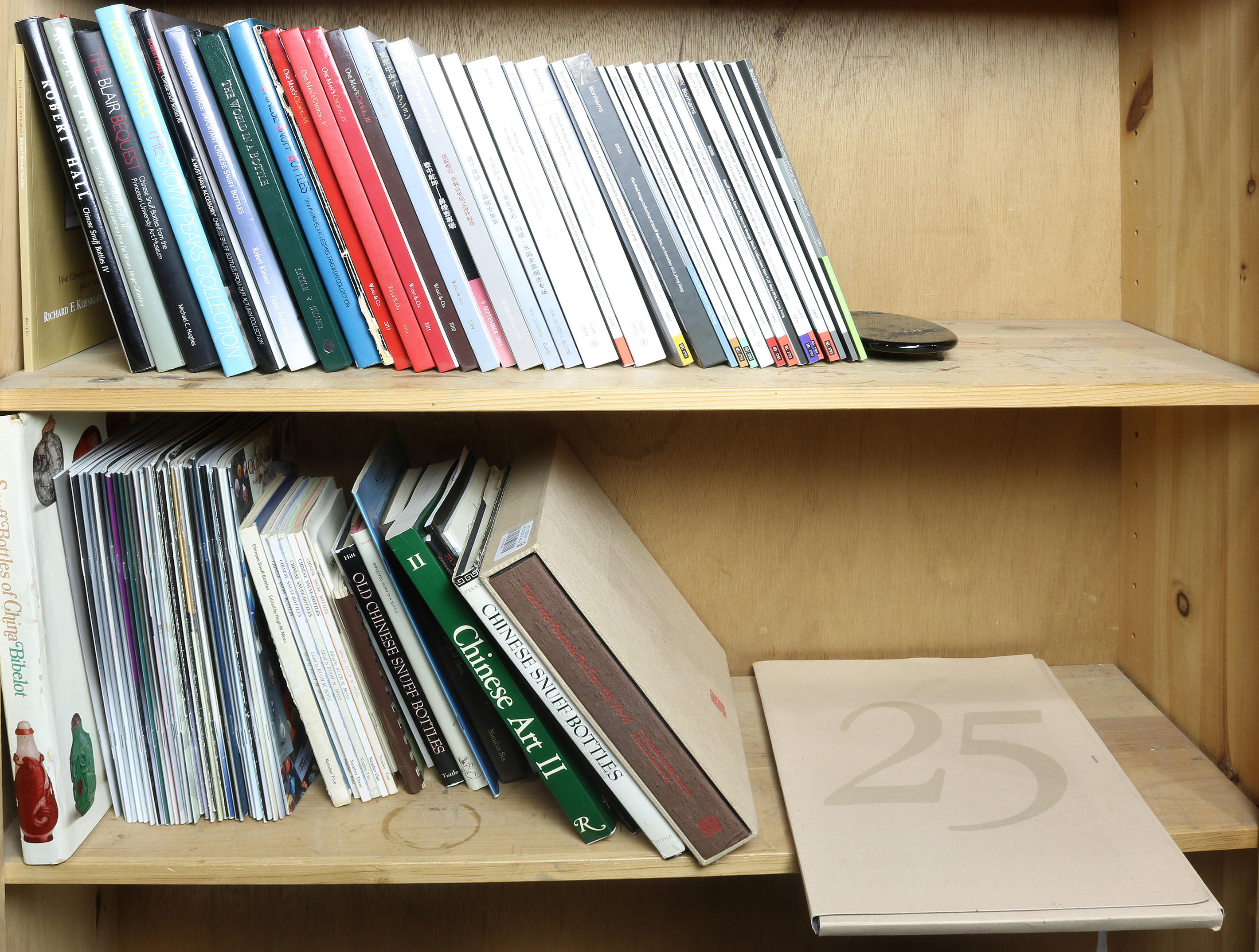 TWO SHELVES OF BOOKS ABOUT SNUFF