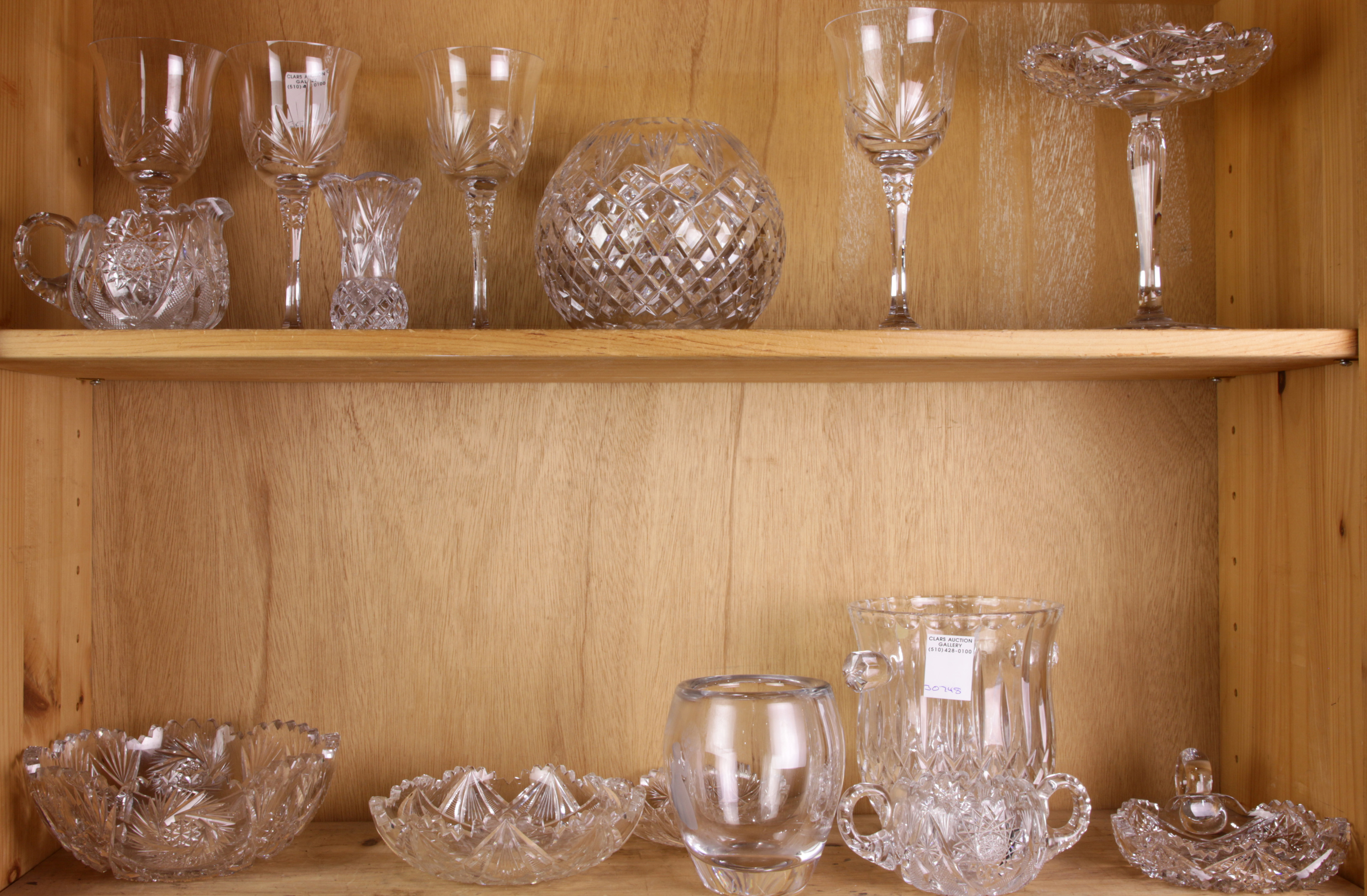 TWO SHELVES OF CUT GLASS