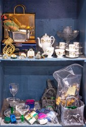 TWO SHELVES OF DECORATIVE ARTS