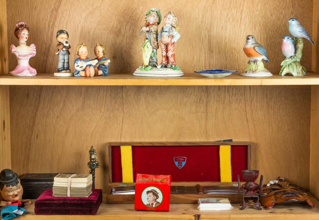 TWO SHELVES OF DECORATIVE ARTS