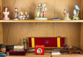 TWO SHELVES OF DECORATIVE ARTS
