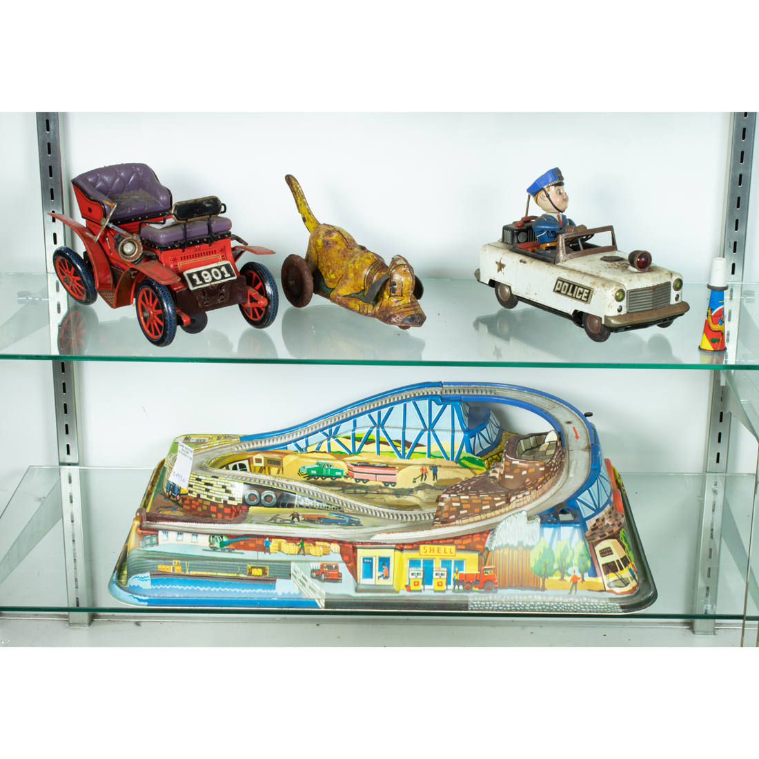 TWO SHELVES OF LITHOGRAPHIC TIN
