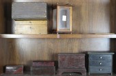 TWO SHELVES OF MOSTLY BOXES Tw