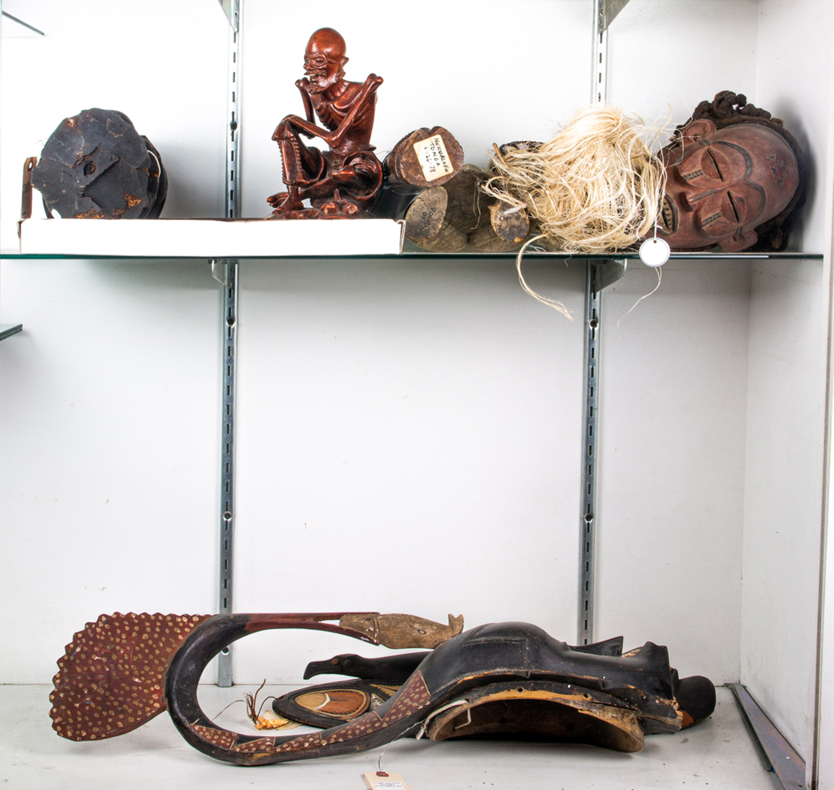 TWO SHELVES OF OCEANIC ART
