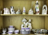 TWO SHELVES OF PORCELAIN FIGUR