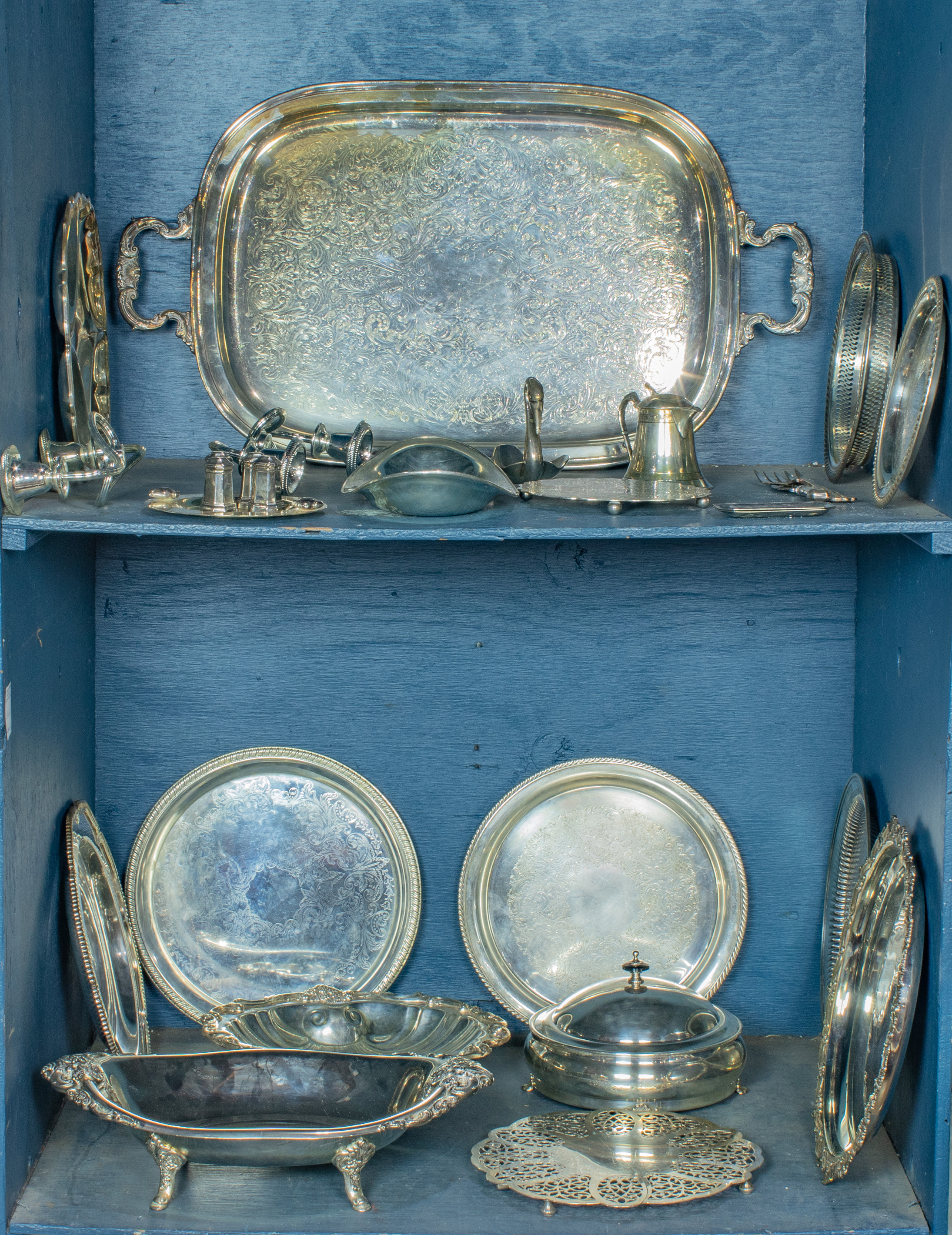 TWO SHELVES OF SILVERPLATE