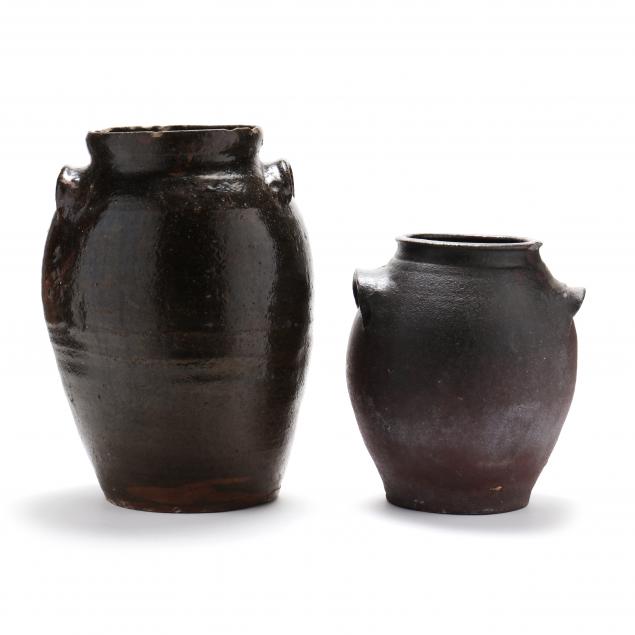TWO SIGNED STORAGE JARS,