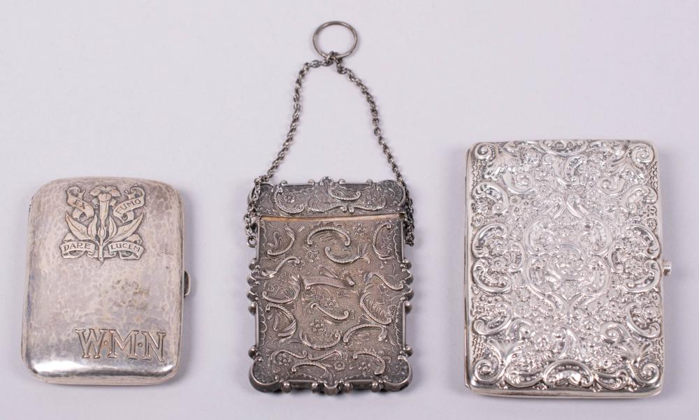 TWO SILVER CASES, BY OMAR