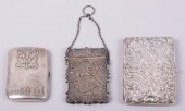 TWO SILVER CASES, BY OMAR RAMS