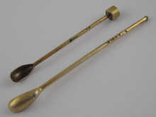 Two silver cayenne pepper spoons