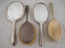 Two silver dressing table sets each