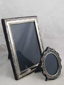 Two silver photograph frames one