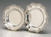 Two silver plates, both with s