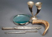 TWO SILVERED METAL DAGGERS, A