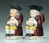 Two similar pearlware Toby jug