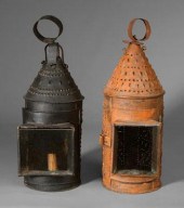 Two similar punched tin lanter