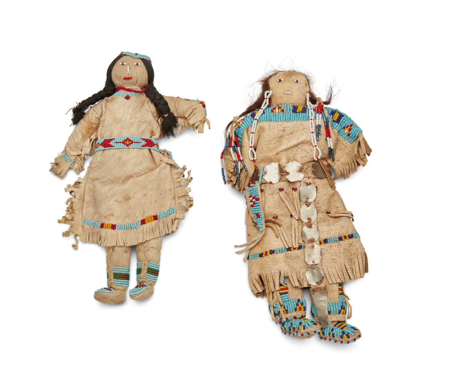 TWO SIOUX BEADED HIDE DOLLSTwo