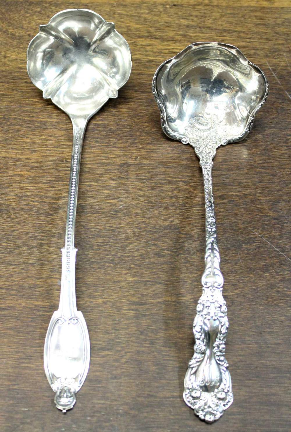 TWO SOLID SILVER SOUP LADLES,