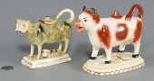 TWO STAFFORDSHIRE COW CREAMERS