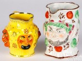 TWO STAFFORDSHIRE SATYR PITCHE