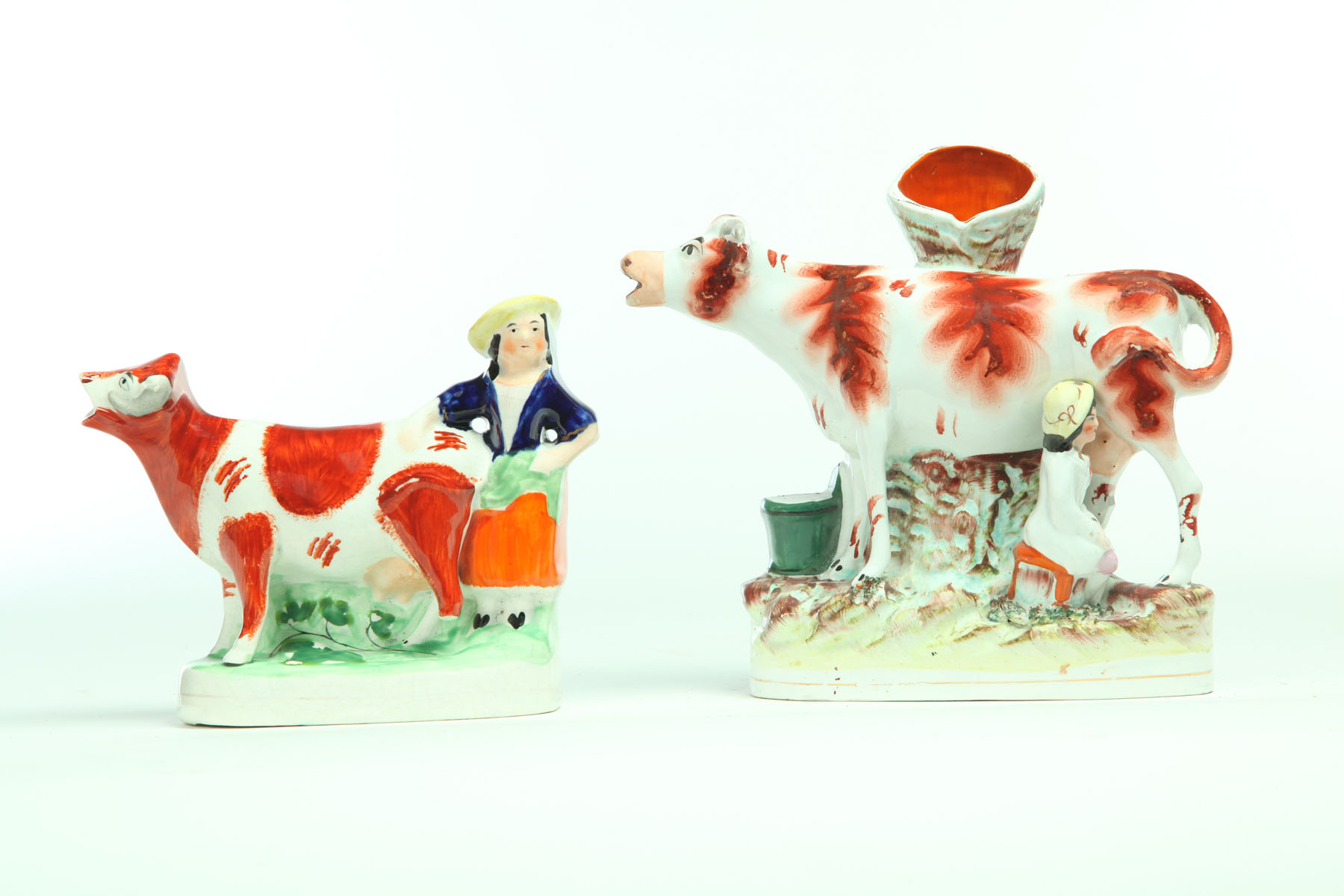 TWO STAFFORDSHIRE SPILL VASES. 