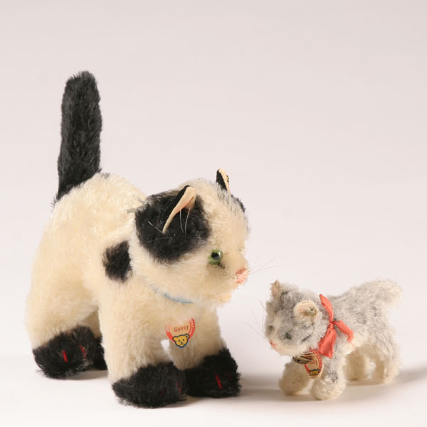 Two Steiff cats, Gussy and Tabby,