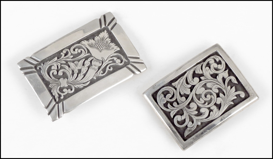 TWO STERLING SILVER BELT BUCKLES.