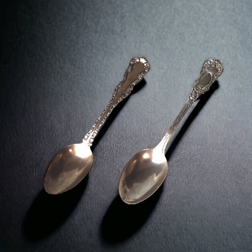 TWO STERLING SILVER TEA SPOONS,