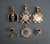 TWO TESTED 10-KARAT GOLD PINS