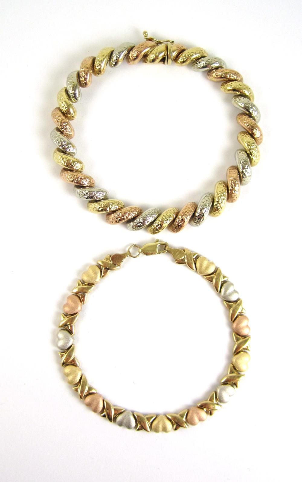 TWO THREE-TONE GOLD LINK BRACELETS,