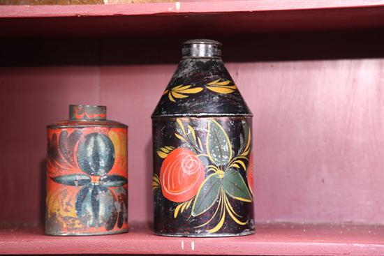 TWO TOLE CANISTERS. One black 