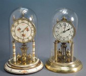 TWO TORSION PENDULUM CLOCKS BY