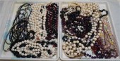 TWO TRAYS OF COSTUME NECKLACES