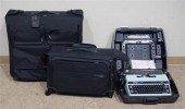TWO TUMI BLACK VINYL LUGGAGE A
