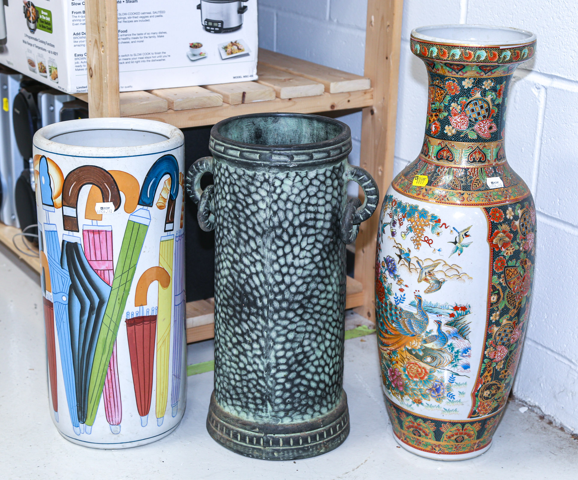TWO UMBRELLA STANDS & A VASE