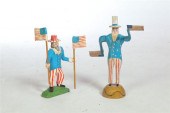 TWO UNCLE SAM CARVINGS.  Ameri