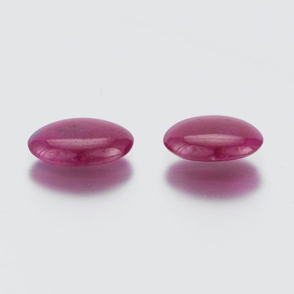 TWO UNMOUNTED 6.86 CARAT TOTAL OVAL