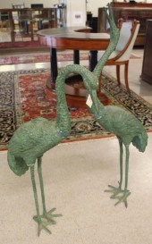 TWO VERDE BRONZE GARDEN CRANES