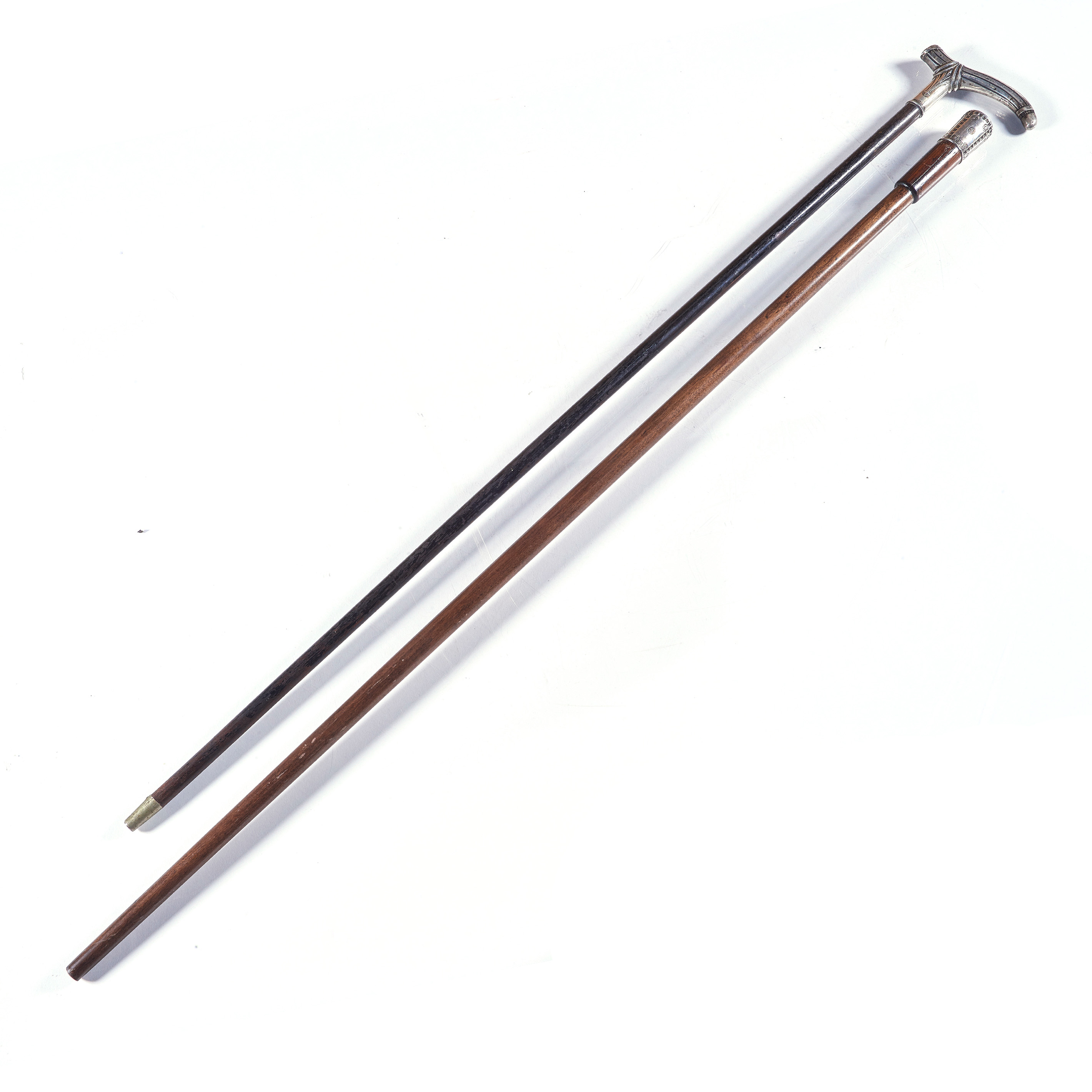 TWO WALKING CANES WITH SILVER
