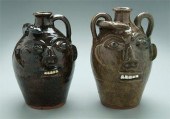 Two Walter Fleming face jugs: