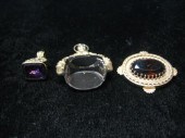 Two watch fobs and one small b