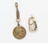 Two Watch Fobs Containing: an
