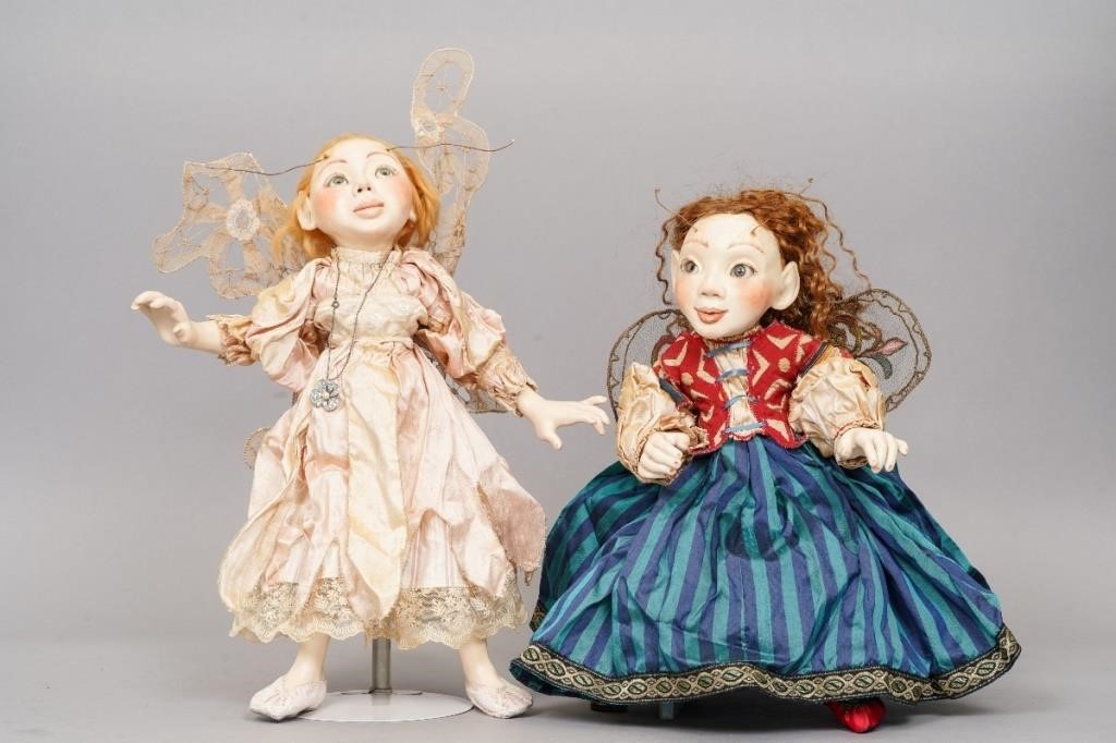 Two wax over porcelain winged fairy