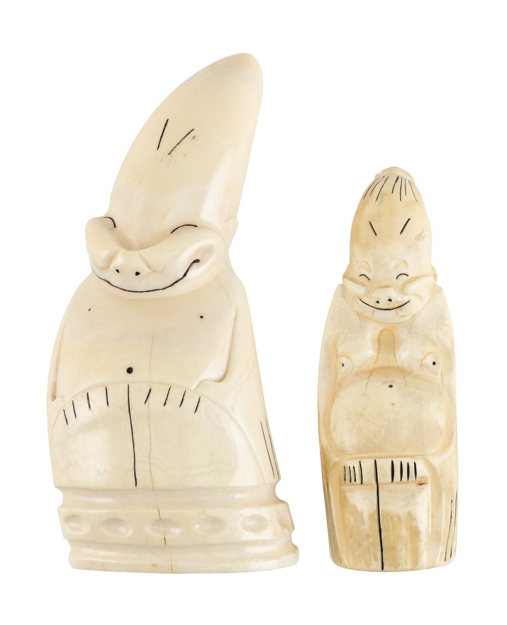 TWO WHALE'S TEETH CARVED IN