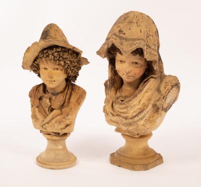 Two white clay busts of children,